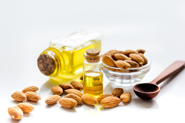cosmetic and therapeutic almond oil on white background