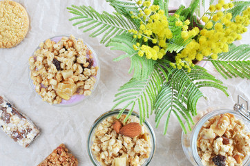 crunchy muesli bars with yogurt and mimosa top view