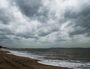 View of storm seascape with dark clouds.