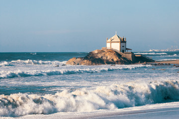 Chapel Senhor da Pedra at Miramar Beach, Atlantic ocean near Porto, Portugal.