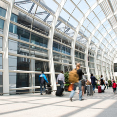 People rushing in the lobby. motion blur