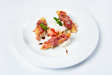 Baguette pieces covered with grilled bacon on plate served luxury. - 142975883
