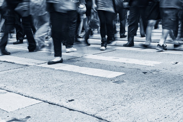 Busy city people on zebra crossing street in Hong Kong, China.
