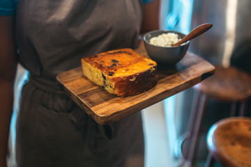 Sweet french toast with white sugar creme on the wooden board