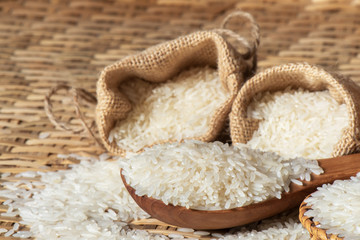 Fototapeta na wymiar Close-up jasmine rice with scoop wooden