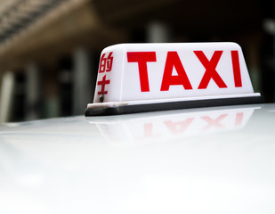 Taxi sign on the street, Hong Kong. selective focus