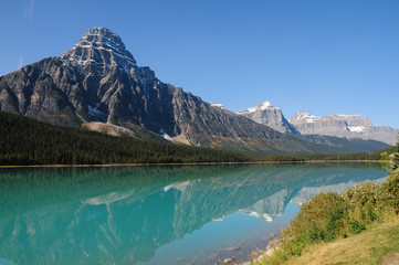 Fototapeta na wymiar Rocky Mountains reflecting in Waterfowl Lake, Alberta, Canada. Icefields Parkway, Banff National Park.