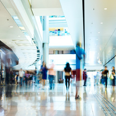 People rushing in the lobby. motion blur