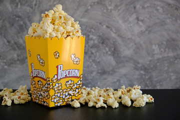 Popcorn on the table with grey background  - 142980616