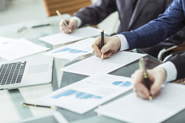 hands business team that works with financial schemes