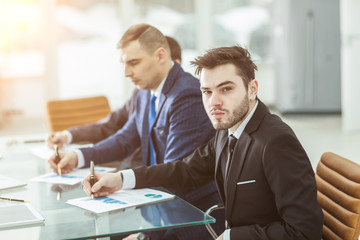 Manager Finance and business team are working with financial charts at his Desk