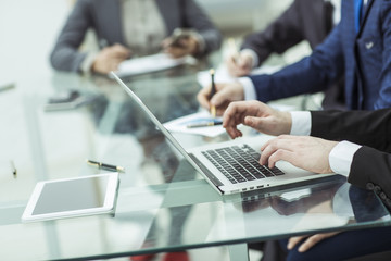 business team using a laptop is doing a marketing report on workplace