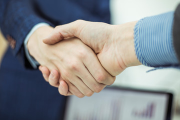 concept of partnership in business: a handshake of business partners