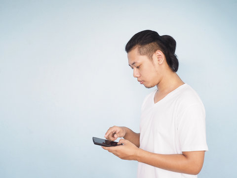 Asian Young Hipster Man Wear White T-shirt Playing Mobile Phone