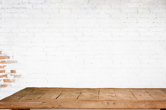 Empty Top Of Natural Wooden Table And Retro White Brick Wall Background. For Product Display