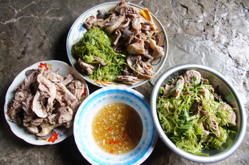 Bow of boiled duck and morning glory salad with fish sauce and ginger