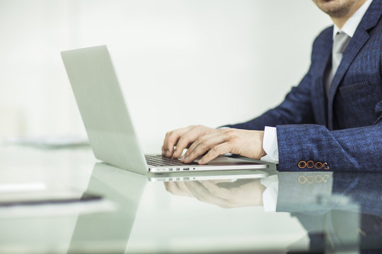 successful businessman working on laptop in the workplace.