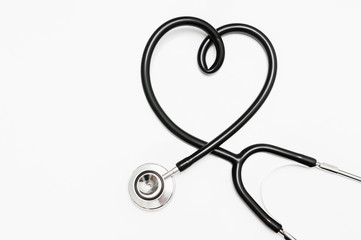 Stethoscope in shape of heart isolated on white background