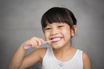 Little asian cute girl brush teeth