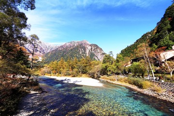 Fototapeta na wymiar Kamikochi is the crown jewel of the Japanese Alps. The scenic area is a basin at 1500 meters elevation. One of the most beautiful tensions hangs between the booming urban life in big cities and the re