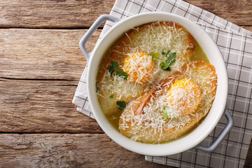 Italian baked bread soup alla Pawese close-up. horizontal top view
