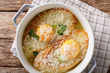 Italian bread Pawese soup close-up in a saucepan. horizontal top view