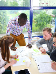 startup business team on meeting in modern bright office interior brainstorming, working on laptop and tablet computer