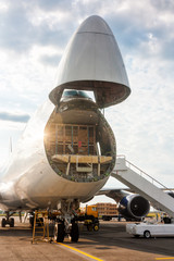 Fototapeta na wymiar Unloading widebody cargo aircraft