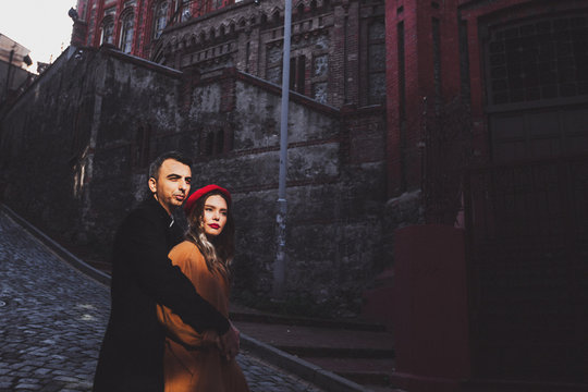 Fashion couple photo with sharp sunlight. Background of  Rum Ortodoks Patrikhanesi Cathedral