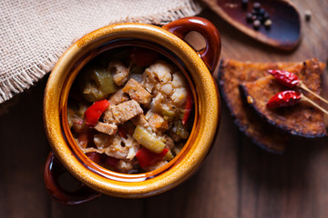 Beef meat stewed with vegetables and cutting bread