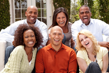Obraz premium Multi ethnic group of people smiling outside.