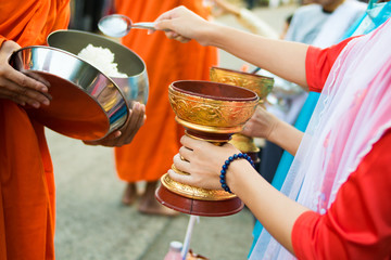 Myanmar girls give alms in the morning