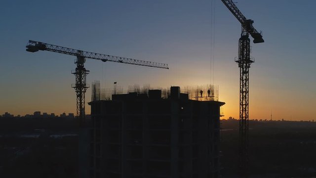 Construction site at sunset. Aerial shot