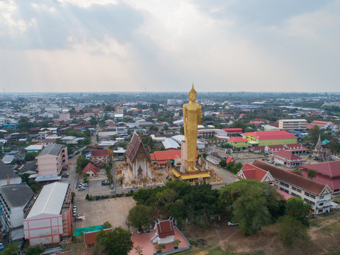 Aerial view of TALLEST STANDING BUDDHA IMAGAE IN Roiet, THAILAND - BURAPAPIRAM TEMPLE 