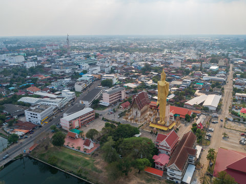 Aerial view of TALLEST STANDING BUDDHA IMAGAE IN Roiet, THAILAND - BURAPAPIRAM TEMPLE 