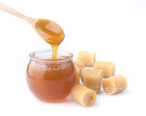 Coconut sugar and sugar syrup in glass bowl on white background
