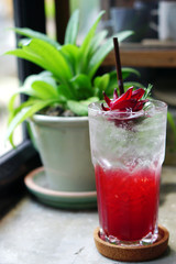 Roselle Iced Tea Mocktail with lemon or Hibiscus sabdariffa Tea is a herbal tea made as an infusion from crimson of the roselle flower, Healthy Drink Concept.