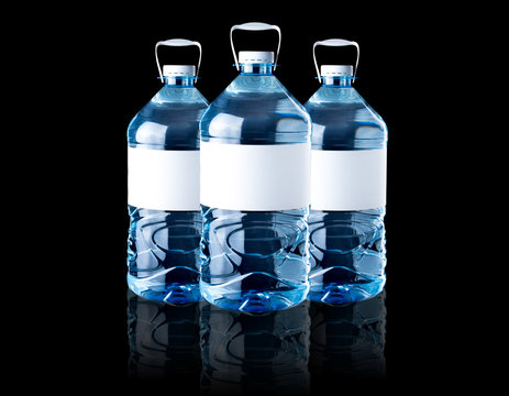 Big bottle of water with clean water isolated on black background