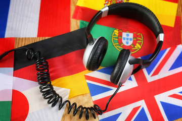 course language headphone and flag on a table