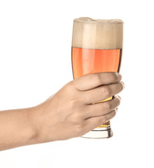 hand hold glass mug of dark beer isolated on white