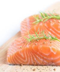 Sliced raw salmon on cutting board,white background