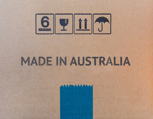 MADE IN AUSTRALIA written on brown cardboard box.