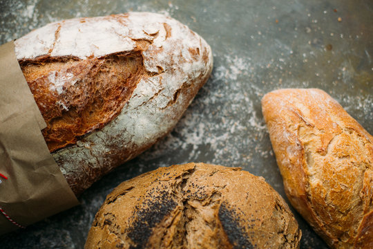 Rustic bread loaf on dark background