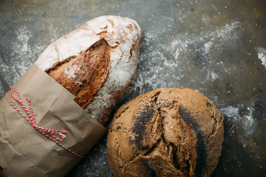 Rustic bread loaf on dark background