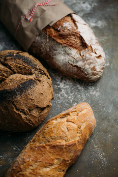 Rustic bread loaf on dark background