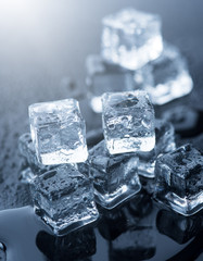 Ice cubes over dark background