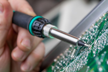 Fototapeta premium Repair of electronic devices, tin soldering parts