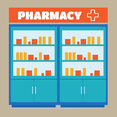 Male pharmacist in a pharmacy opposite the shelves