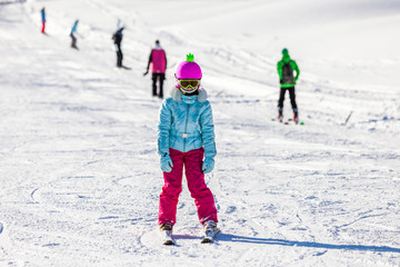 Baby girl on alpine skiing