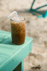 Enjoying an iced coffee on the beach